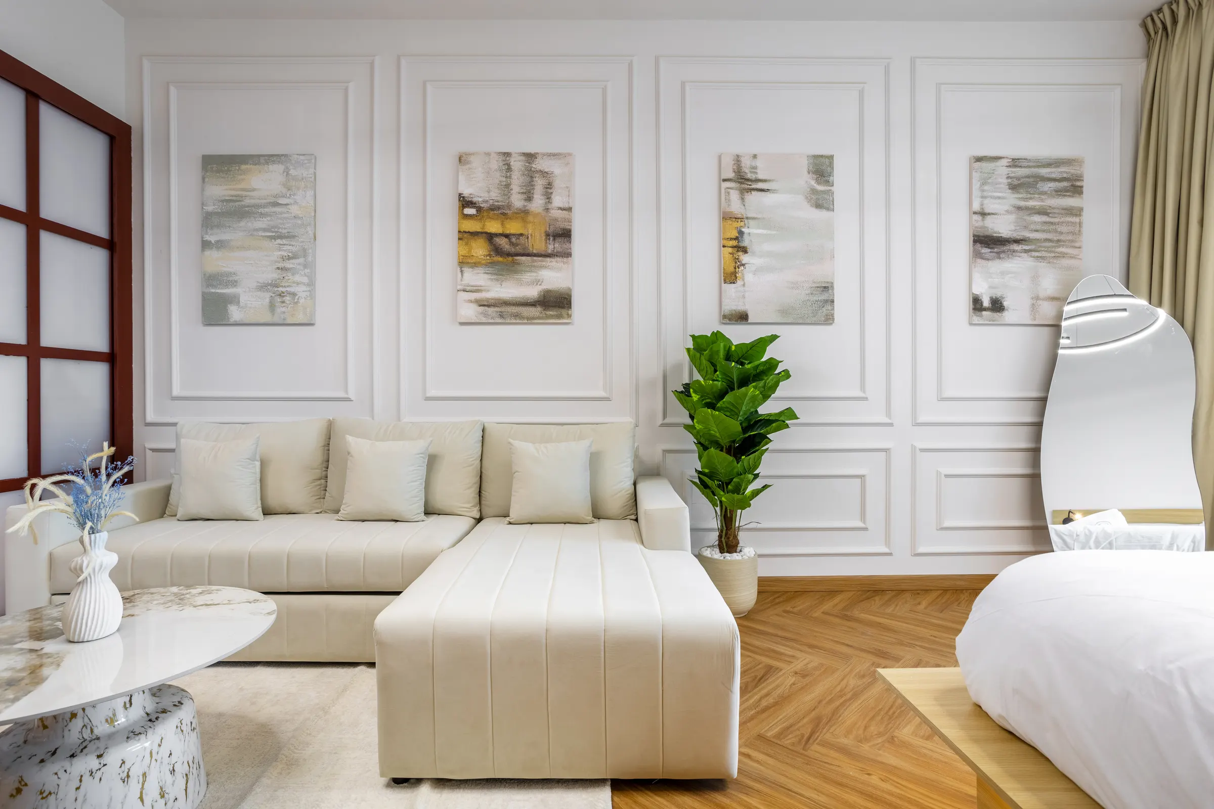 Cream sectional against a panelled wall — Sulafa Tower, Dubai Marina